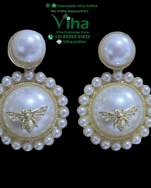 Stylish Beads Stud, two gold-toned earrings featuring a large white bead atop a larger circular pendant ringed with sixteen smaller white beads, centering a bee