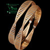 Designer Bangle with a twisted, undulating profile and grooved pattern