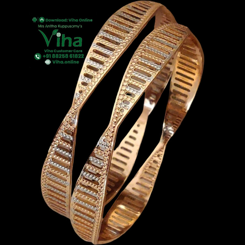 Designer Bangle with a twisted, undulating profile and grooved pattern