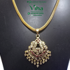 Impon Attiyal, a gold-toned necklace with a woven chain and an ornate pendant inset with clear and pink stones and dangling beaded fringe