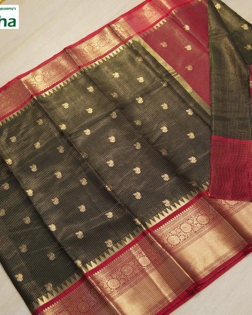Premium Cotton Silk Saree With Blouse, folds of a dark green and red textile with gold-toned motifs
