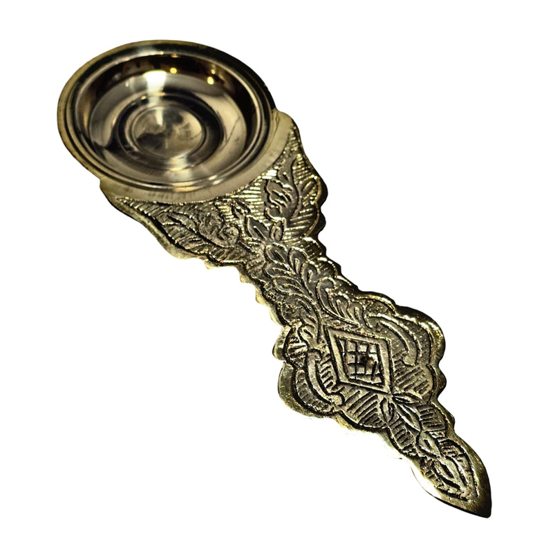 Dhoobakarandi, brass camphor holder with a shallow round bowl and long flat handle with embossed floral motifs