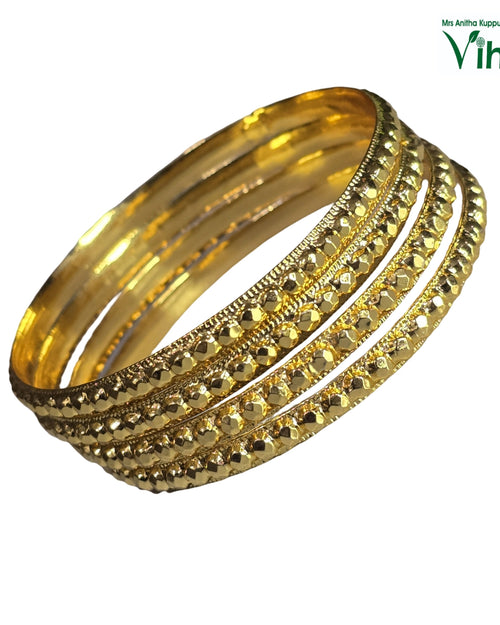 Impon Bangle, four gold-toned bangles, two smooth and two featuring textured, beaded rows with reflective surfaces