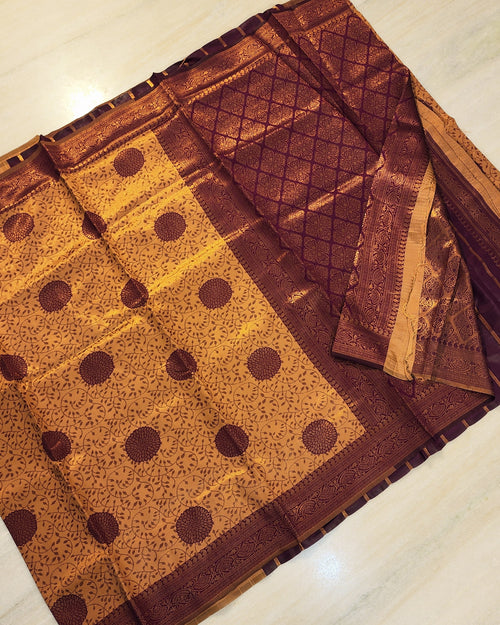 Soft Silk Saree With Blouse, a folded purple and gold-toned fabric featuring patterned panels with floral and geometric motifs