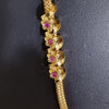 Impon Mugappu Chain, a gold-toned chain with four red-set circular elements and a textured mesh design