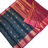 Semi Soft Silk Saree With Blouse, a folded dark green fabric with gold-toned round motifs and magenta-and-gold borders