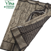 Cotton Silk Saree With Blouse, a dark brown patterned fabric with metallic silver-toned woven borders and intricate tie-dye style motifs