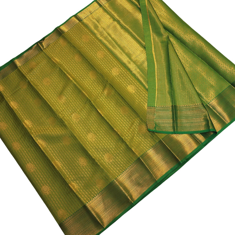Semi Soft Silk Saree With Blouse, folded green fabric with shiny gold-toned borders and woven circular medallion patterns