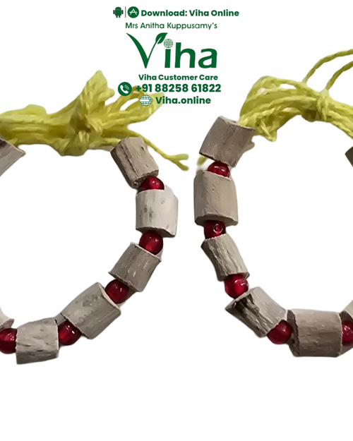 Baby Vasambu Bangle, pale wood beads strung with red accent beads on yellow thread