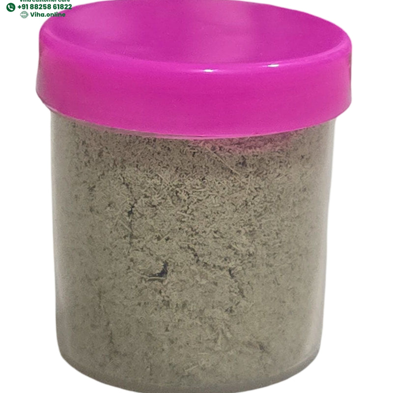Cardamom Powder / Ilaichi Powder in a container with a pink lid