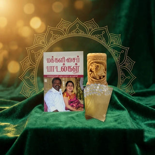 Makkal Isai Paadalgal (folk songs) Tamil book, carved wooden elephant pen stand and gold gift envelopes on green velvet