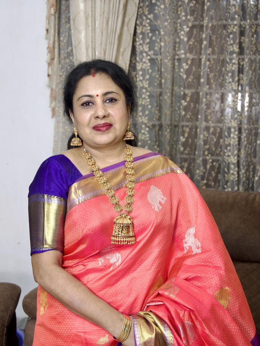 Mrs Anitha Kuppusamy, founder of Viha Online, in a coral silk saree