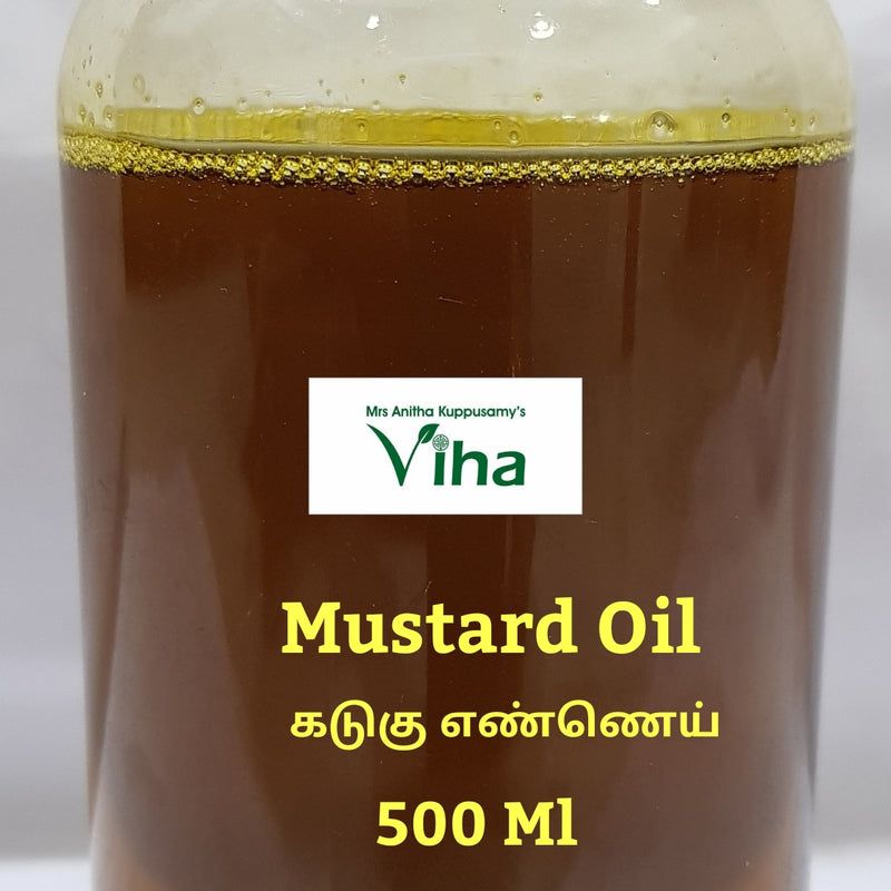 Cold Pressed Organic Mustard Oil, a tall clear bottle of amber oil with a white ridged screw cap