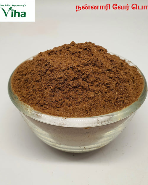Nannari Powder, a clear glass bowl filled with finely ground brown powder sits against a plain white background