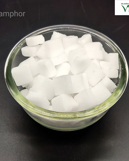 Camphor (Karpooram) cubes in a glass bowl