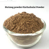 Nutmeg Powder / Jathikkai Powder, a clear glass bowl holding brown powder against a white background