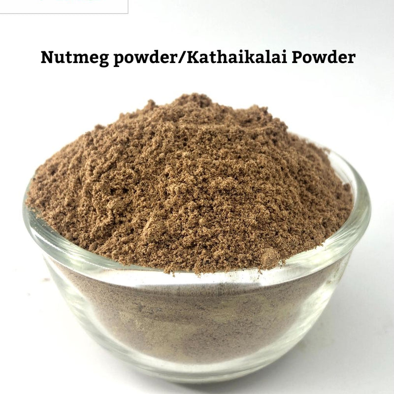 Nutmeg Powder / Jathikkai Powder, a clear glass bowl holding brown powder against a white background
