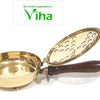 Sambrani Dhoobakkal, a shiny gold-toned metal vessel with three feet, an attached handle, and an open, perforated lid