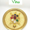 Navaratna Tortoise With Om Plate, tortoise shaped sculpture resting on grains inside a circular shallow dish