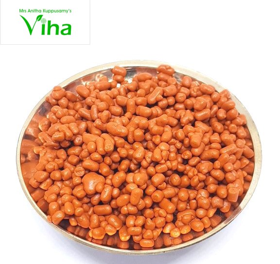 Ashtagandha Chandhana Thilagam, orange pellets in a metal-toned round bowl