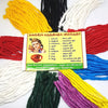 Nine bundles of cotton lamp wick in nine different colours arranged in a circle around a printed Tamil guide card