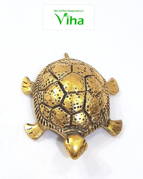 Vastu Tortoise, gold brass turtle figurine with a textured shell, four stubby legs, and a small head extending forward