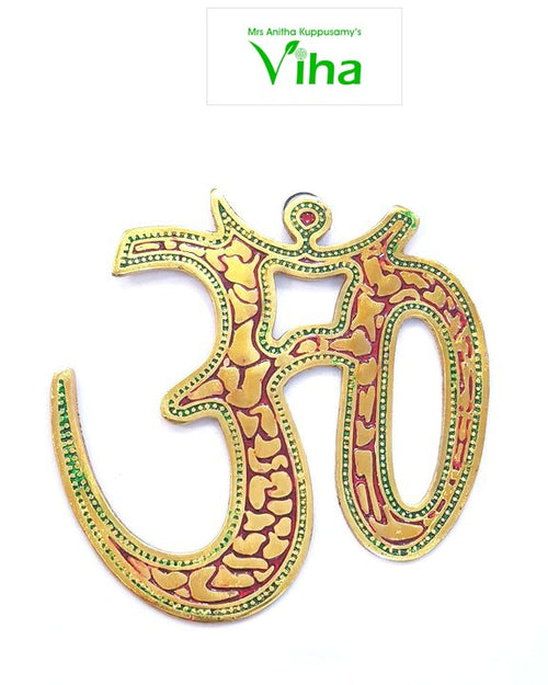 Om Wall Hanging, a gold-toned Om symbol features red and green enamel details with a glossy finish