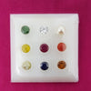 Navaratna Stones With Zircon Stone, nine small stones in a white box with round compartments