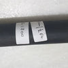 Karungali Rod, a matte black cylinder with two white labels bearing handwritten black ink text
