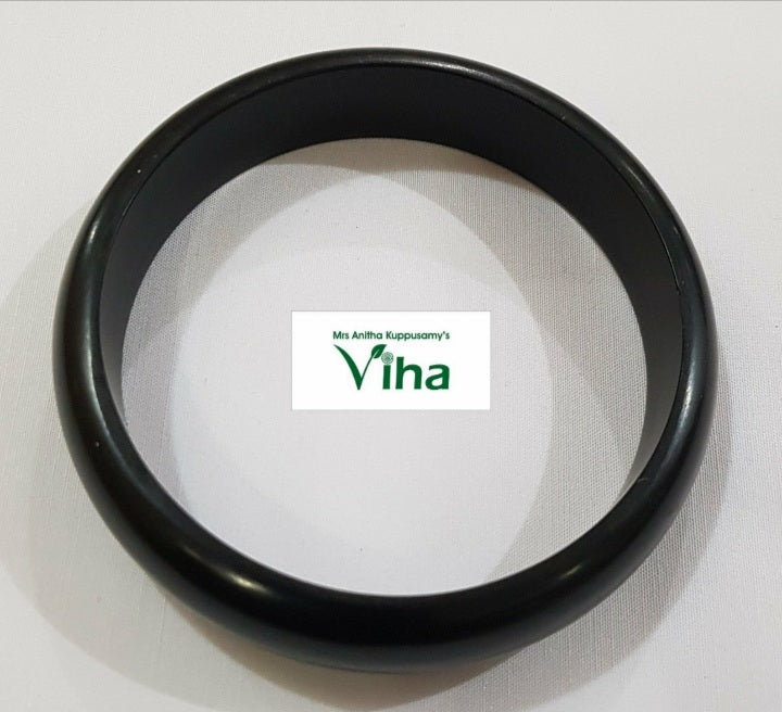 Karungali Wood Bangle, a single black circular band with a smooth, glossy surface finish