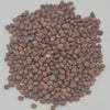 White Radish Seeds / வெள்ளை முள்ளங்கி விதைகள், a large pile of small, rounded, matte brown seeds on a light surface