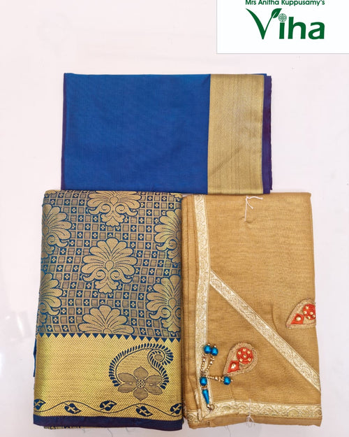 Apoorva Silk Half Saree Set, a blue and gold-toned fabric set with folded textiles featuring floral patterns and decorative bead accents