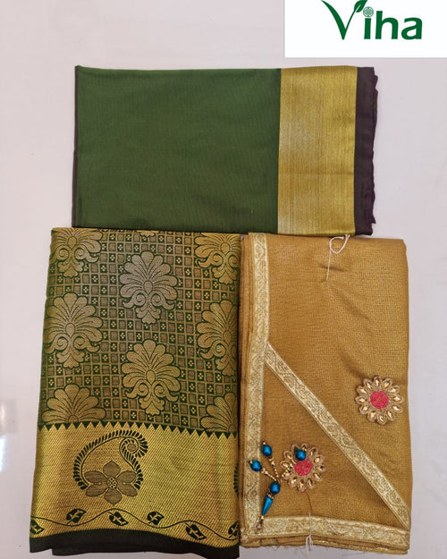 Apoorva Silk Half Saree Set, folded green and gold-toned fabric featuring floral patterns and embroidered patches with clear stones and blue beads