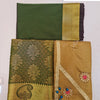 Apoorva Silk Half Saree Set, folded green and gold-toned fabric featuring floral patterns and embroidered patches with clear stones and blue beads