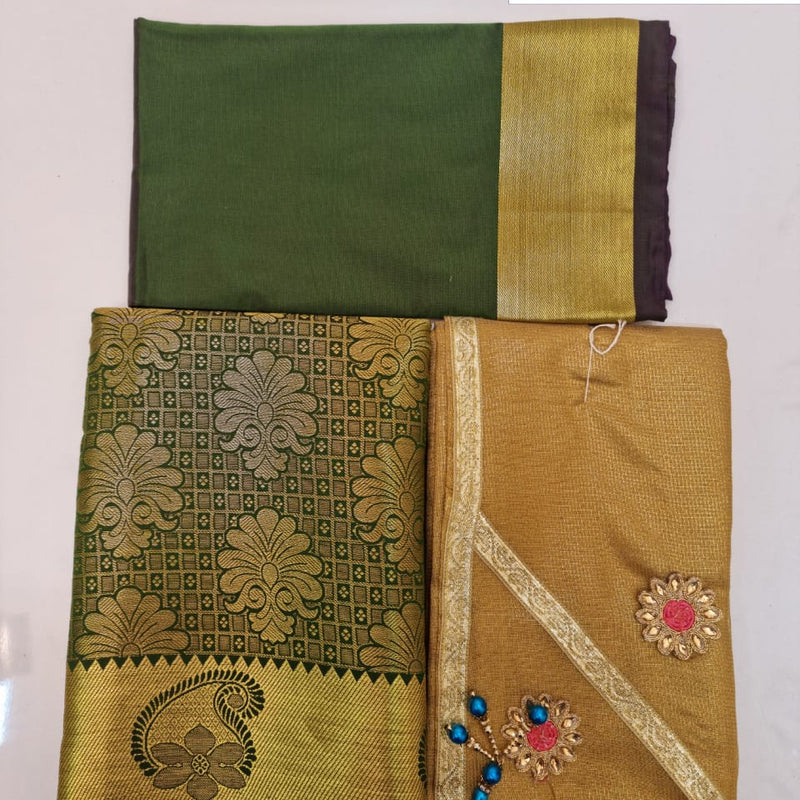 Apoorva Silk Half Saree Set, folded green and gold-toned fabric featuring floral patterns and embroidered patches with clear stones and blue beads