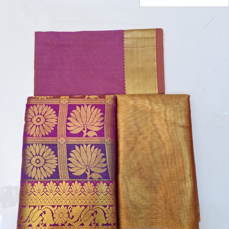 Apoorva Silk Half Saree Set, a purple and gold-toned textile with floral patterns, checkered sections, and wide borders displayed against a white backdrop