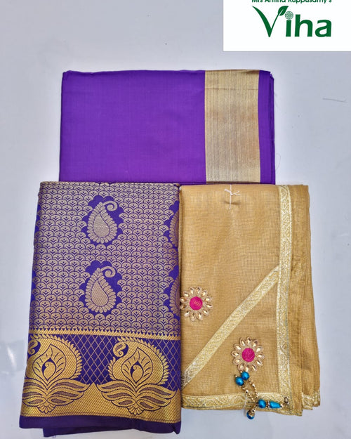 Apoorva Silk Half Saree Set, a purple fabric with gold-toned borders alongside a gold-toned piece featuring two flower-like patches and blue beads