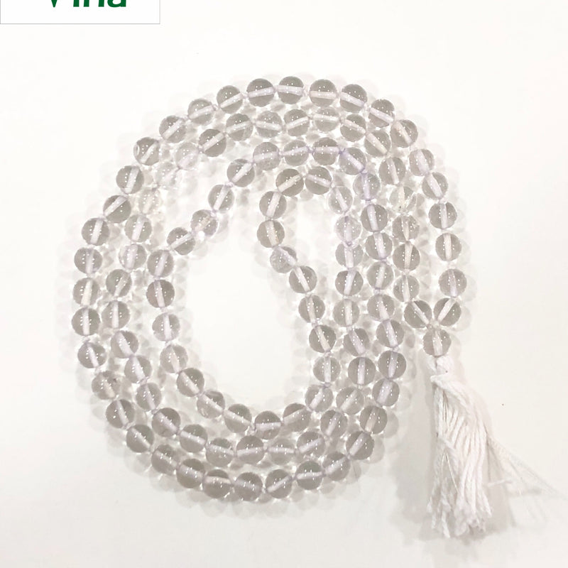 Sphatik Mala, a beaded necklace of multiple glossy clear spheres ending in a white tassel