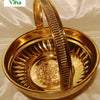 Brass Pooja Flower Basket, a shiny gold-toned basket featuring an arched ribbed handle, fluted interior sides, and an embossed floral center medallion