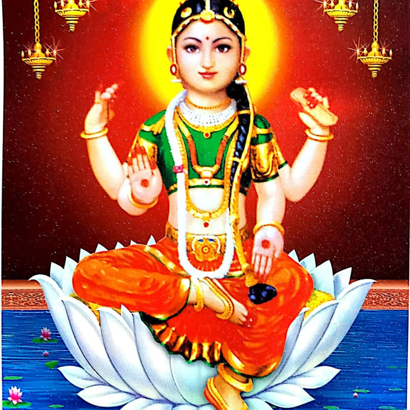Sri Balambigai Photo, a glossy print of a four-armed figure seated on a white lotus over blue water with four hanging lamps against a red haloed background