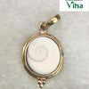 Gomathi Chakra Pendant with Brass frame, a shiny gold-toned pendant holding a round white shell piece with one brown spiral