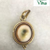 Gomathi Chakra Pendant with Brass frame, a gold-toned round pendant featuring a white shell inset with a green center and three small spheres below