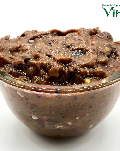 Tamarind Rice Mix | Instant Puliyodharai Mix, in a squat glass bowl