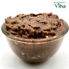 Tamarind Rice Mix | Instant Puliyodharai Mix, in a squat glass bowl