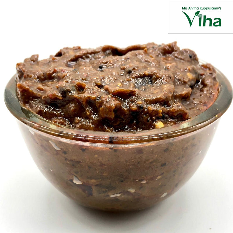 Tamarind Rice Mix | Instant Puliyodharai Mix, in a squat glass bowl