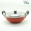 Iron Pan With Stainless Steel Lid, a red round vessel with two side handles and a metallic lid topped with a dark knob
