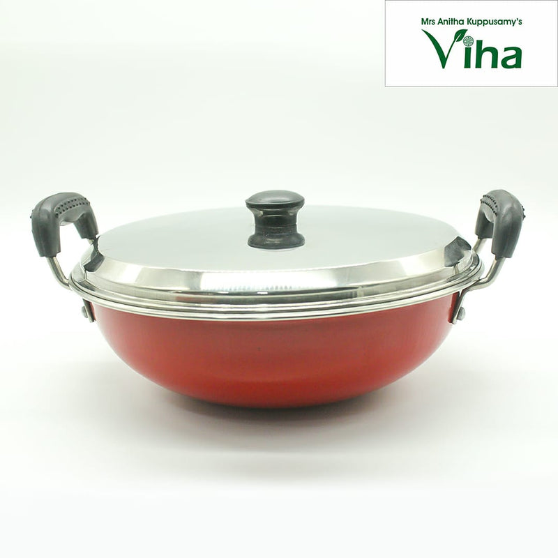 Iron Pan With Stainless Steel Lid, a red round vessel with two side handles and a metallic lid topped with a dark knob