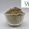 Vallarai Powder / Brahmi Powder, a small clear glass bowl containing a mounded heap of fine, matte brown powder against a plain background