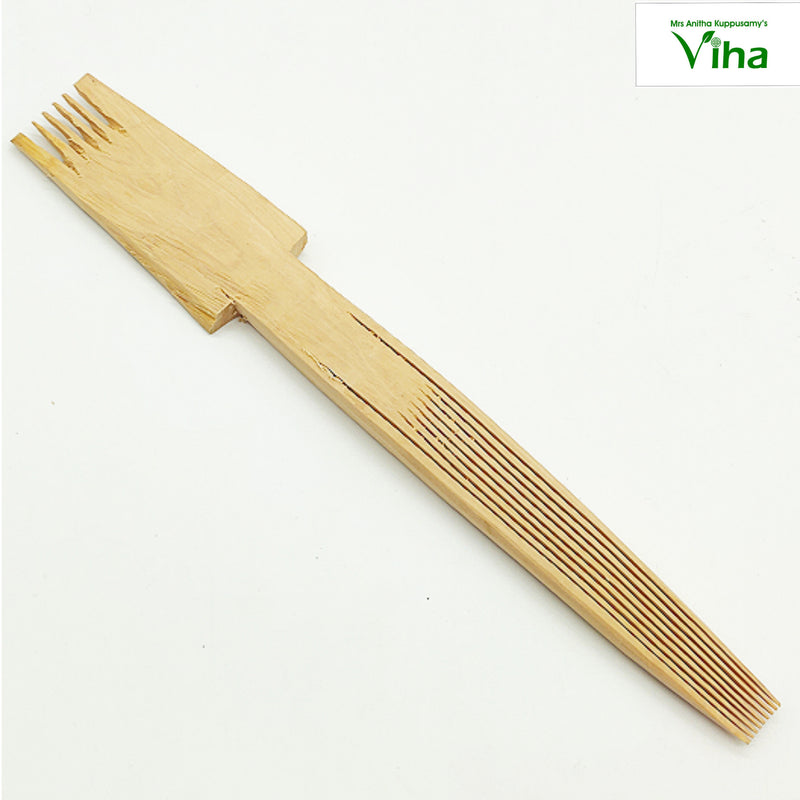 Wooden Nit Comb / Erukoli, a light brown wooden comb with six tines on one end and eleven teeth on the other end