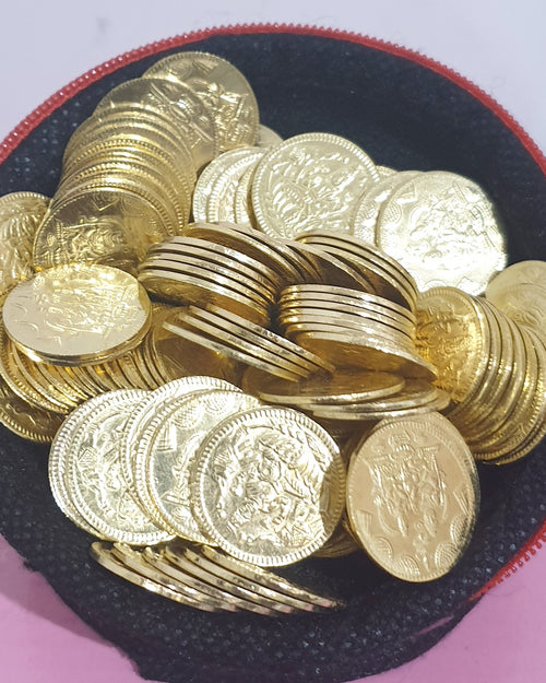 108 Lakshmi Kuber Coins, a pile of gold-toned coins with embossed designs in a black pouch